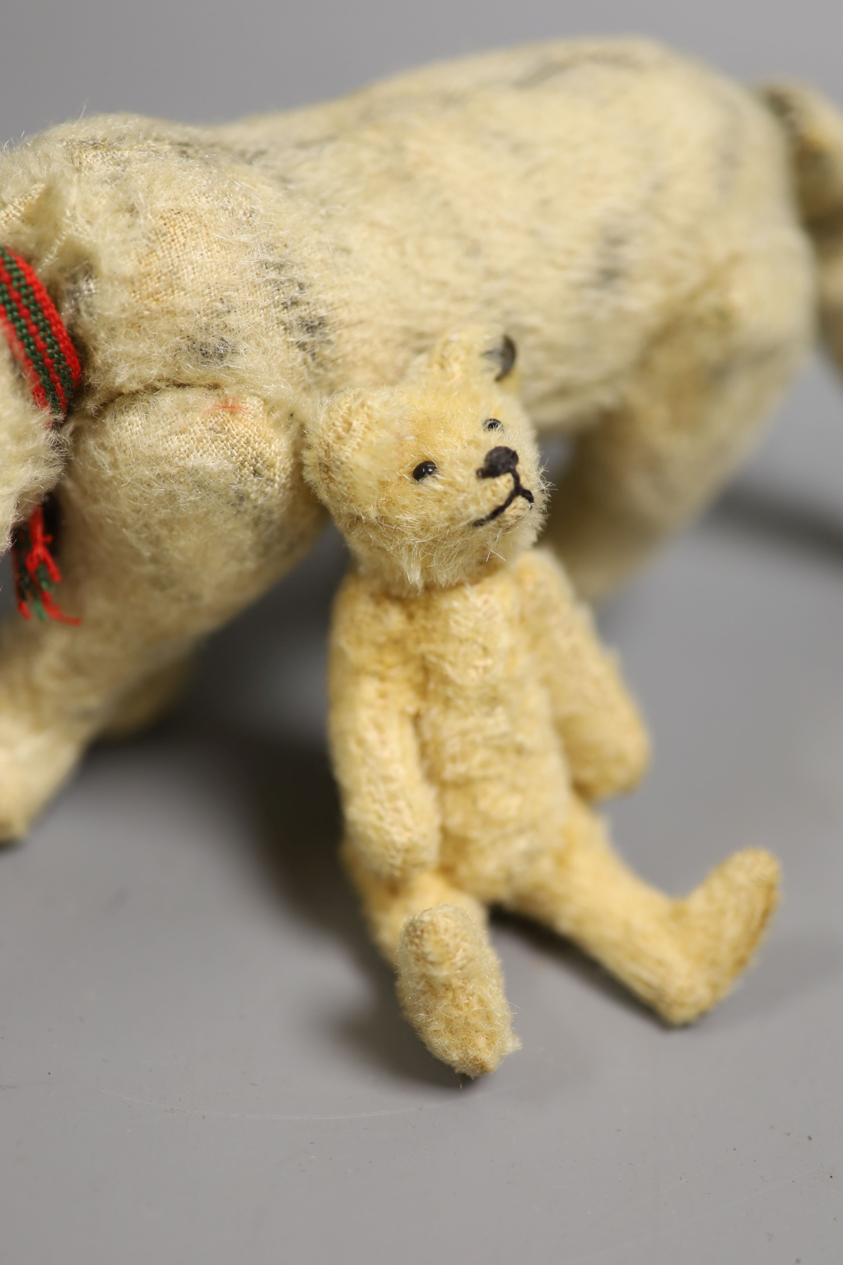 A Steiff miniature Teddy bear, 10cm high together with a cat